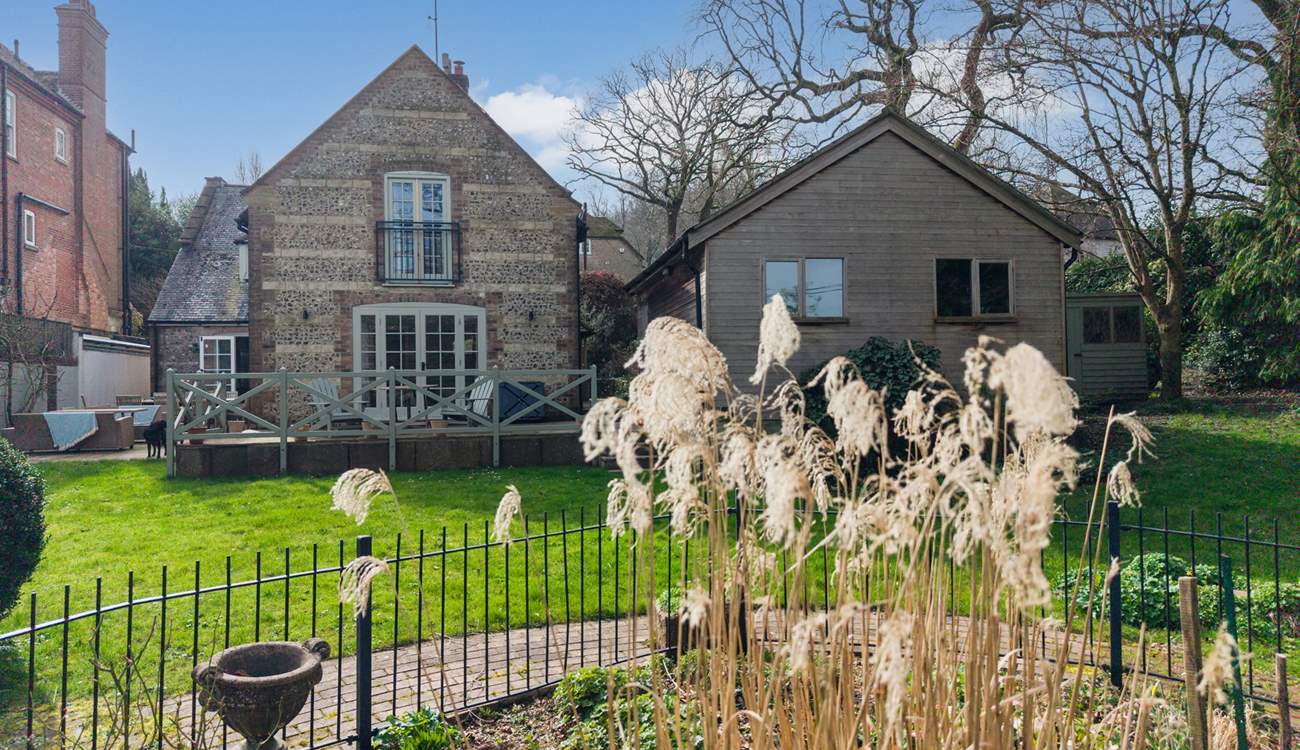 To the right of the house is the games-room and to the left sits the owner's property.