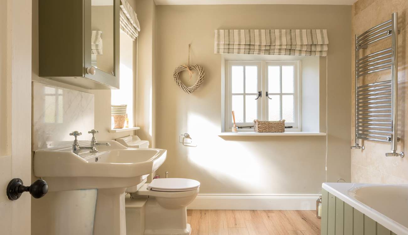 This bathroom boasts some country-chic styling and a wonderful deep bath with shower over. It serves bedrooms 3 and 4.