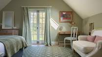 Imagine waking up in this luxurious super-king bed and opening the balcony doors to bird song and the silence of the countryside.