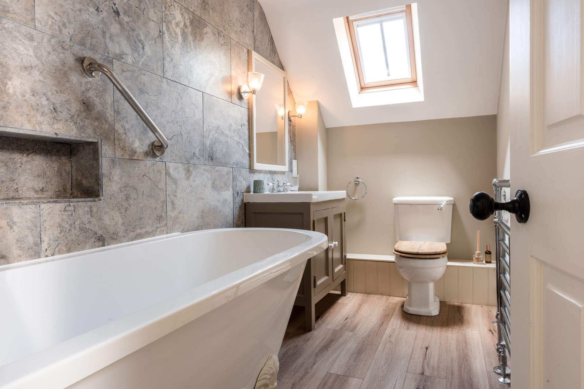 The en suite is tastefully appointed with a deep claw-foot bath and shower over.