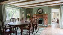The striking dining-room is set for eight and it's dual-aspect provides the most wonderful light and atmospheric room.
