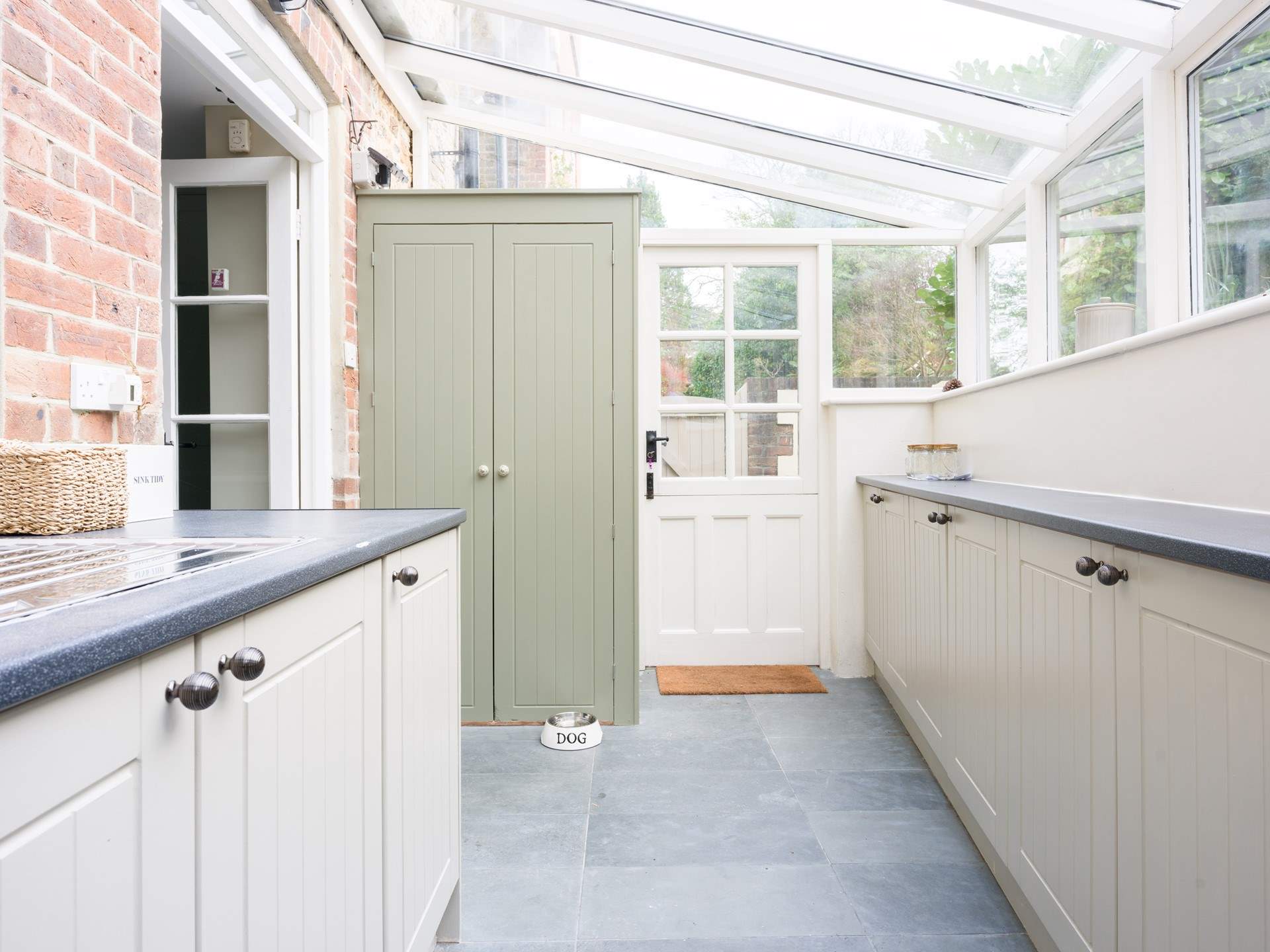 Completing the kitchen-area is this spacious utility/boot-room with washing machine, sink and plenty of storage.