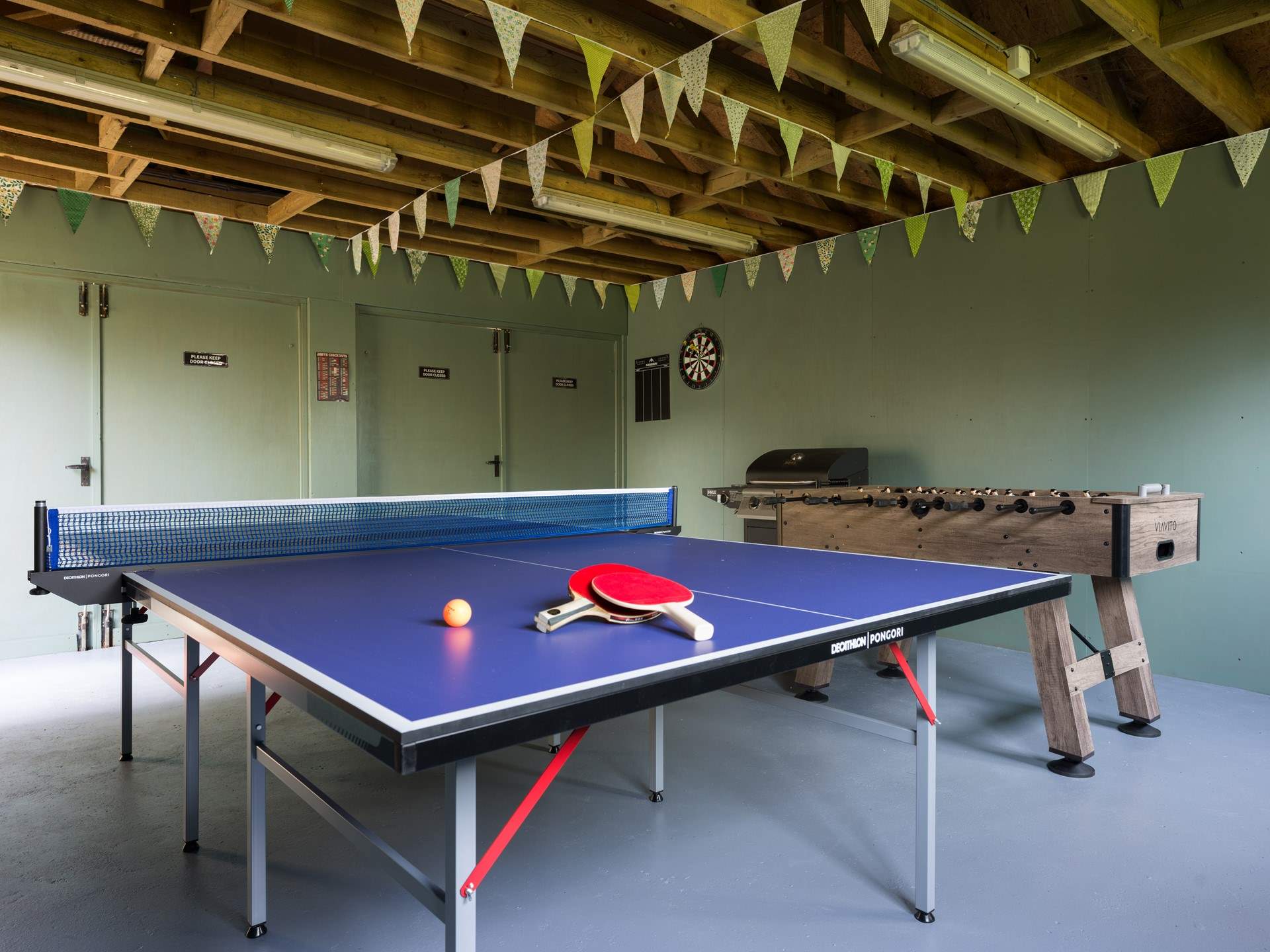 Anyone feeling competitive? Darts, table-tennis and table football on offer here in the garage space next to the house.