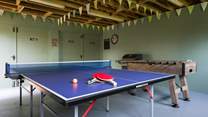 Anyone feeling competitive? Darts, table-tennis and table football on offer here in the garage space next to the house.