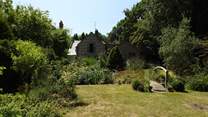 The gently landscaped gardens are a delight. Note that the top section of the garden can be enclosed and secured from the little pond.