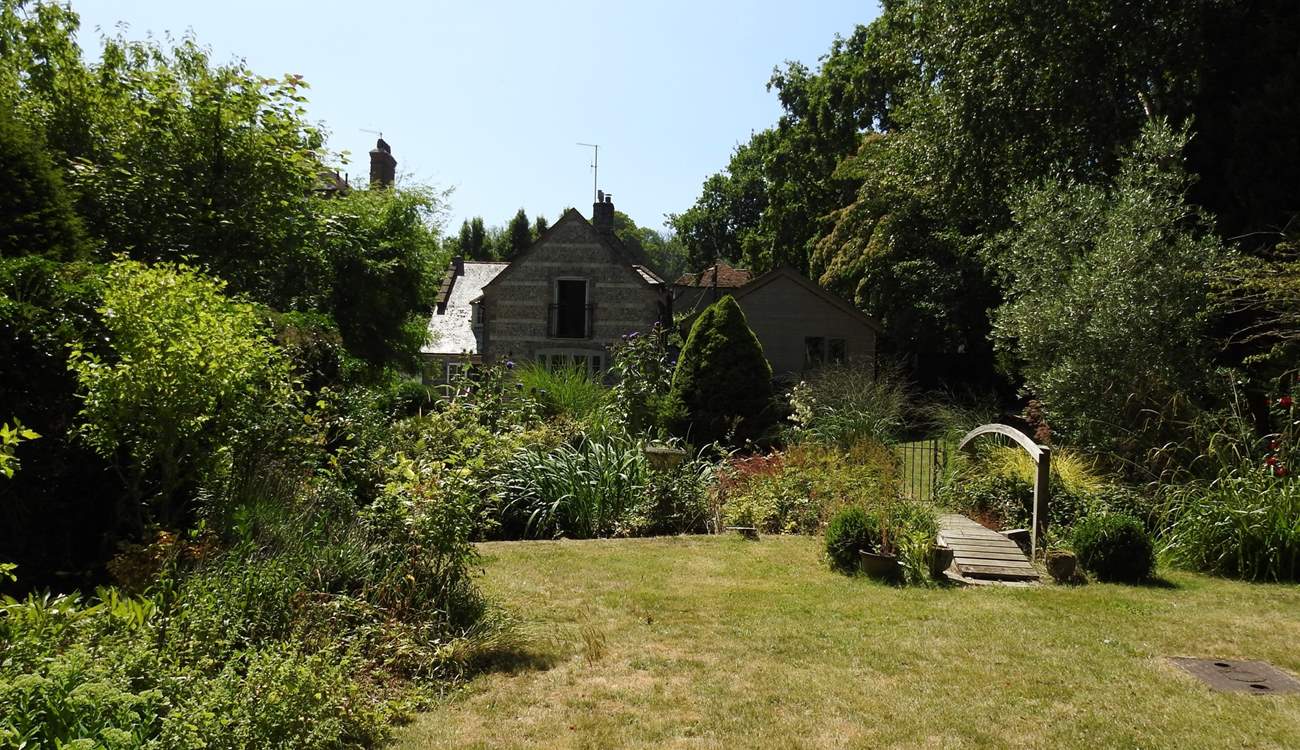 The gently landscaped gardens are a delight. Note that the top section of the garden can be enclosed and secured from the little pond.