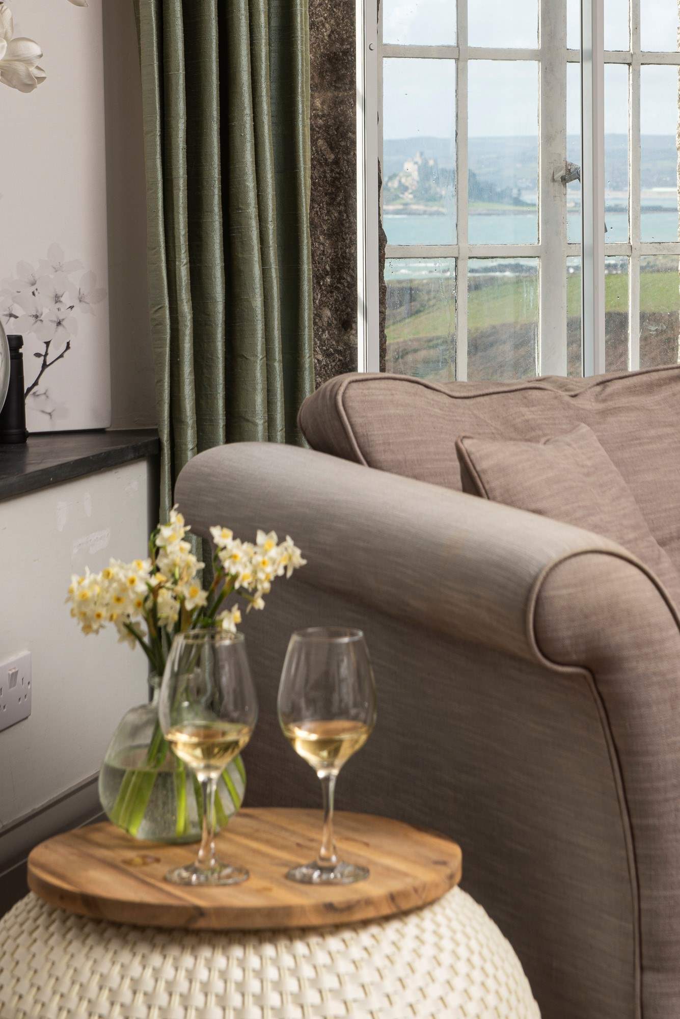 Relax with a glass of wine in this impressive home.