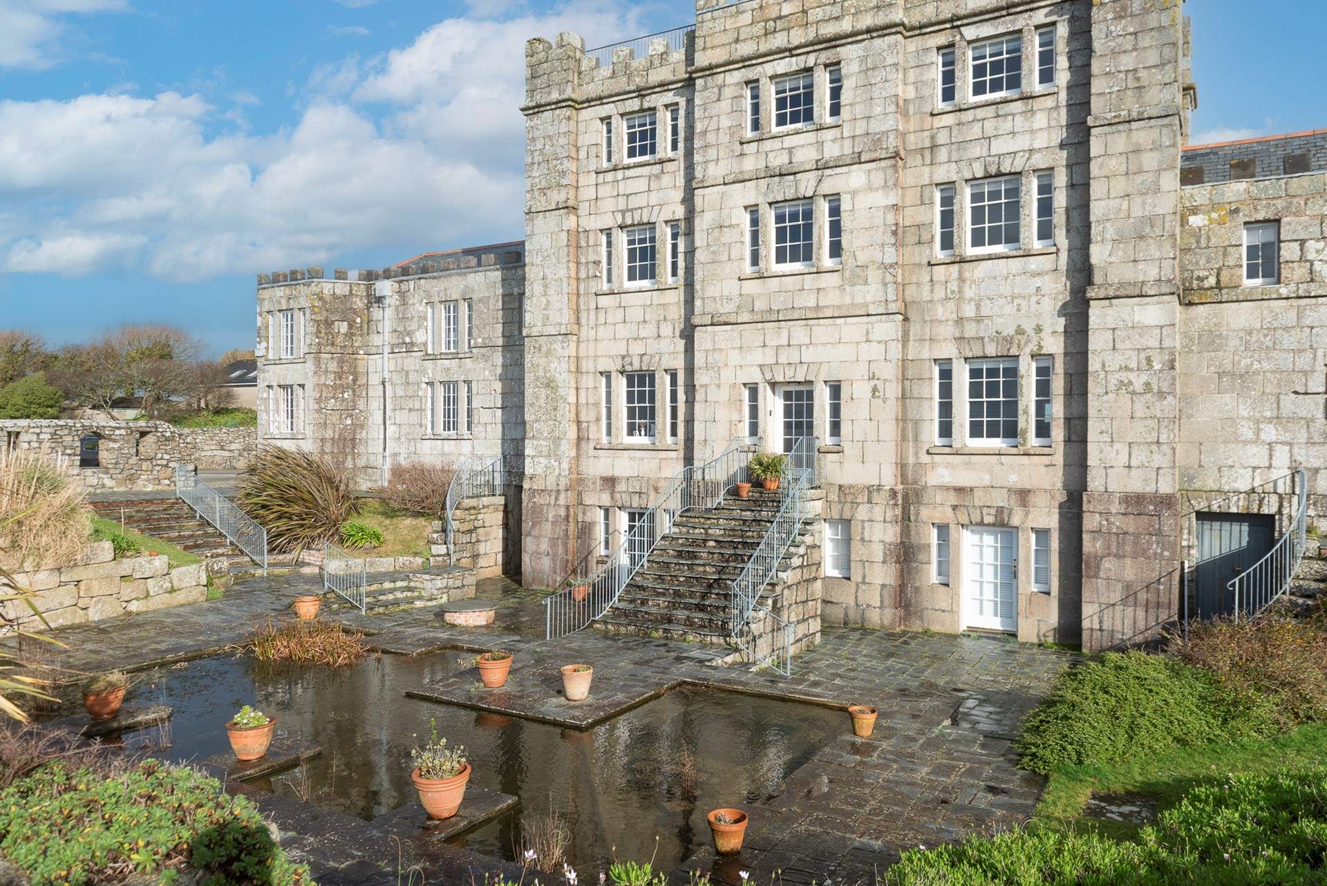 Please take care as there is a large pond in the communal landscaped gardens.