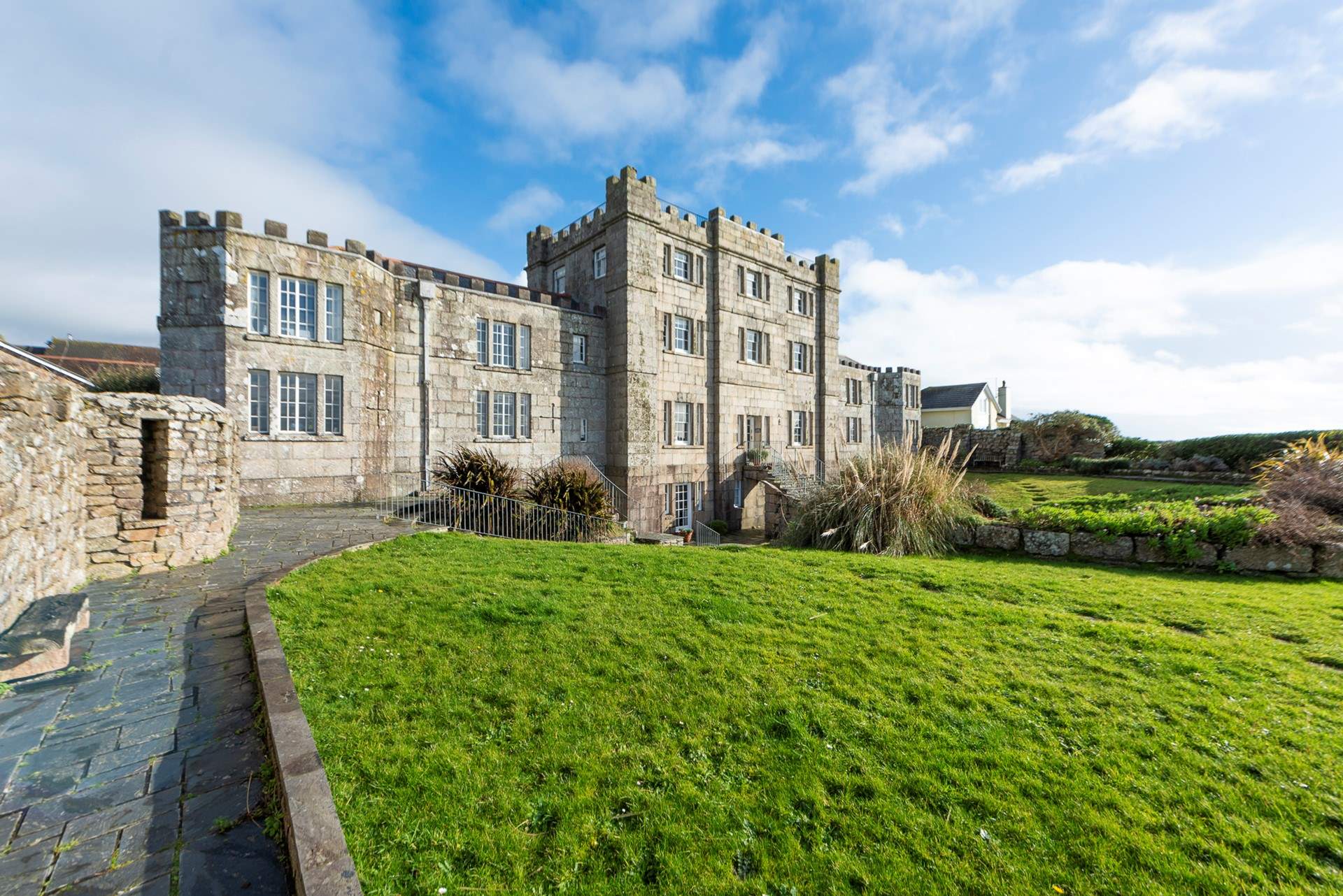 North Wing is the upper apartment on the left as you face the castle. It is accessed by external steps near the private parking area.