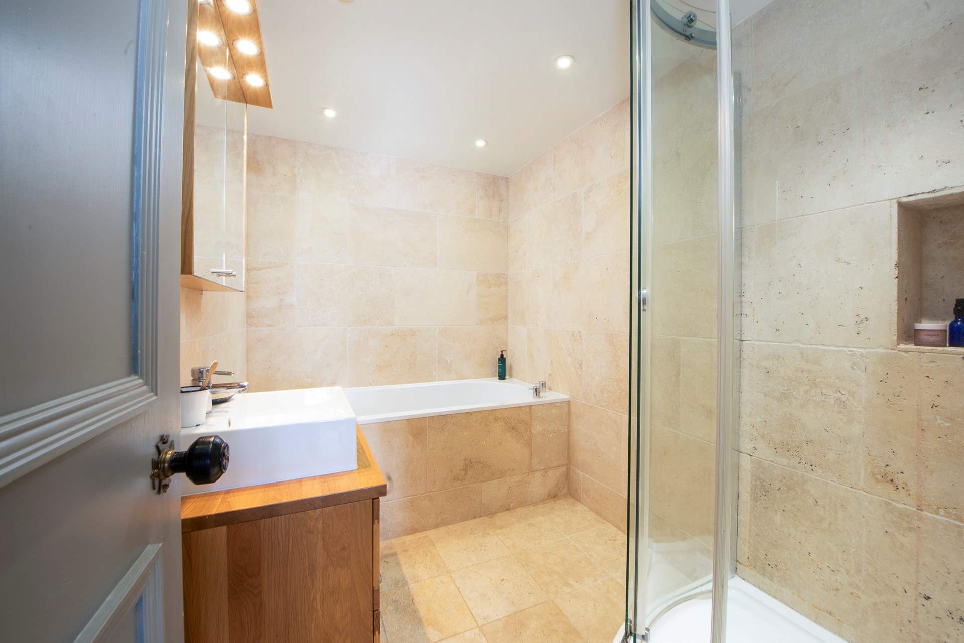 The luxurious family bathroom, complete with bath and separate power shower. The WC is in a separate cloakroom.