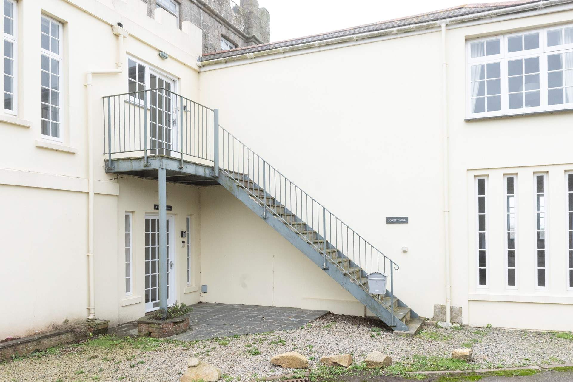 The steps leading up to the front door.