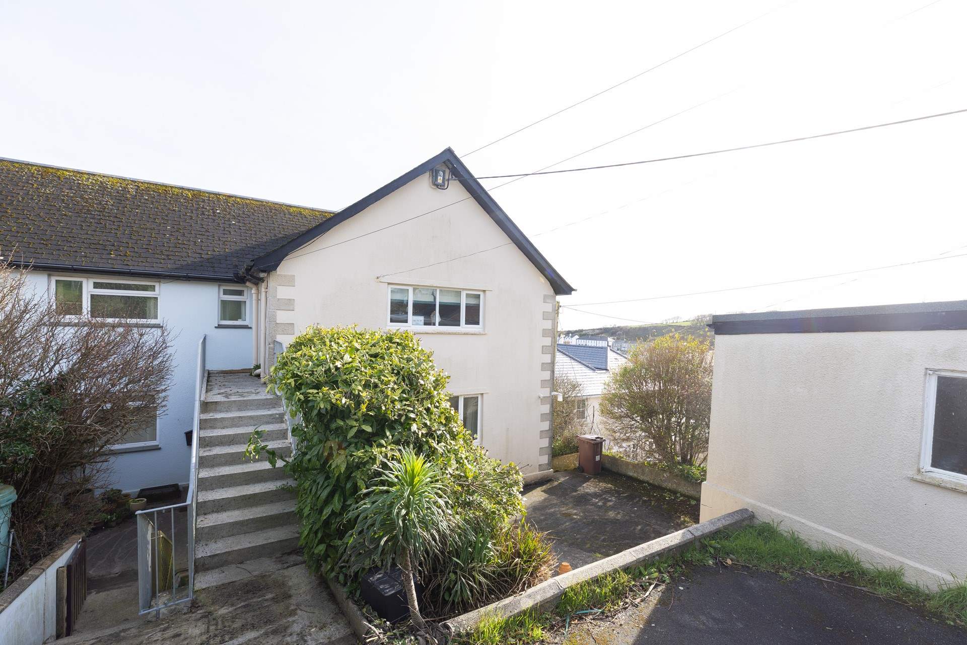 Steps lead up to Ketch at the rear of the property. 