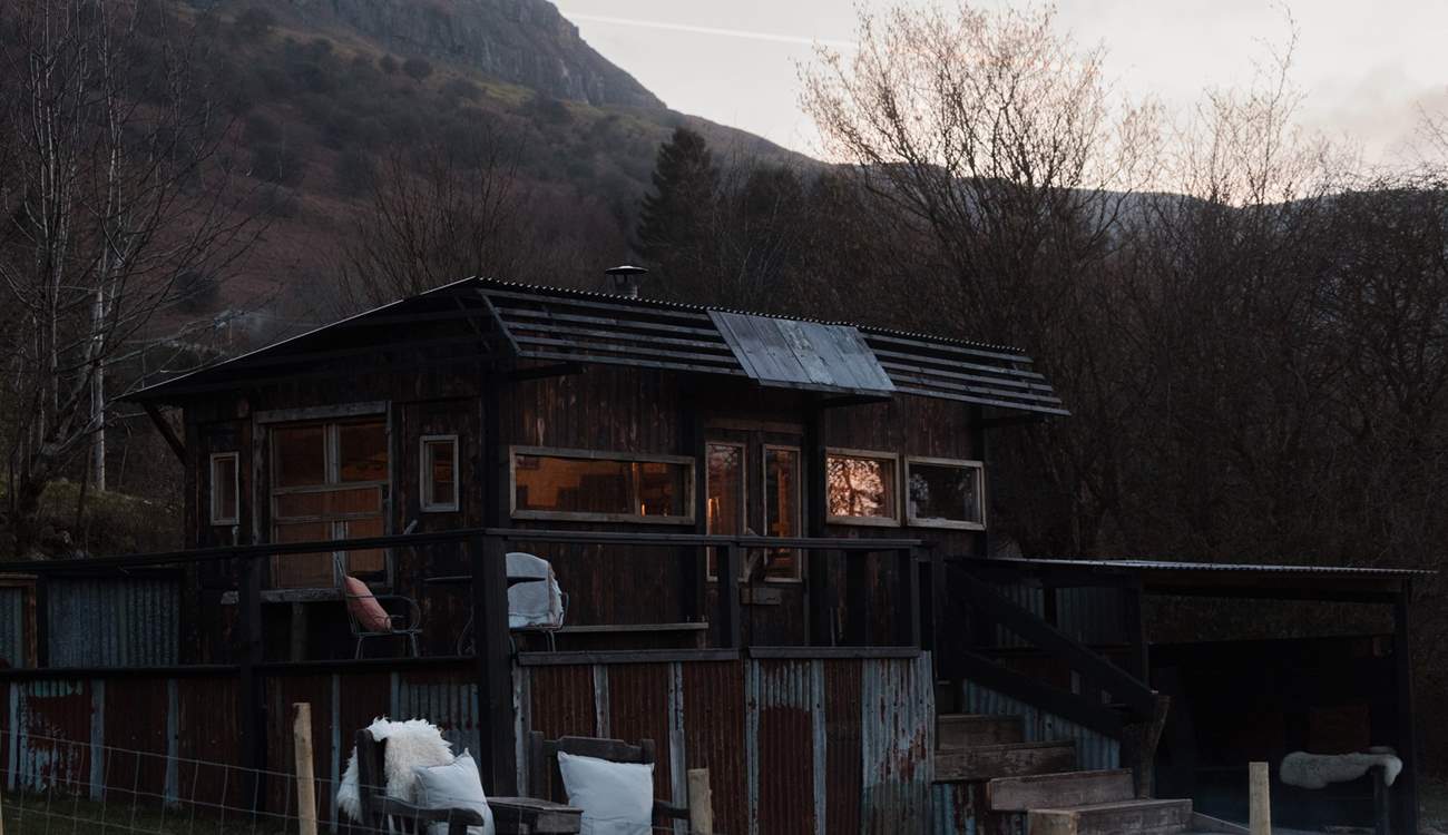 As dusk settles, sink into the stillness, as the last glow of sunset fades over the mountains.
