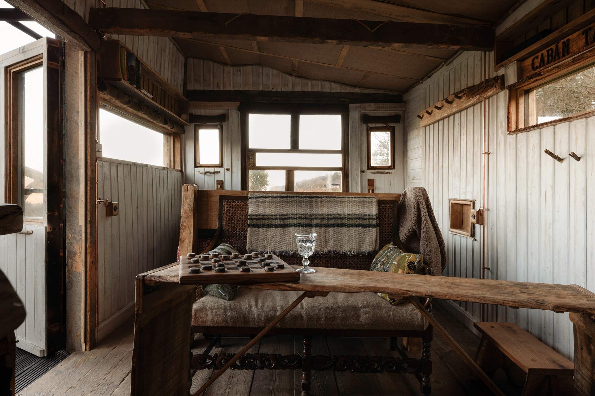 Wooden interiors and thoughtful details that give the cabin a soulful charm.