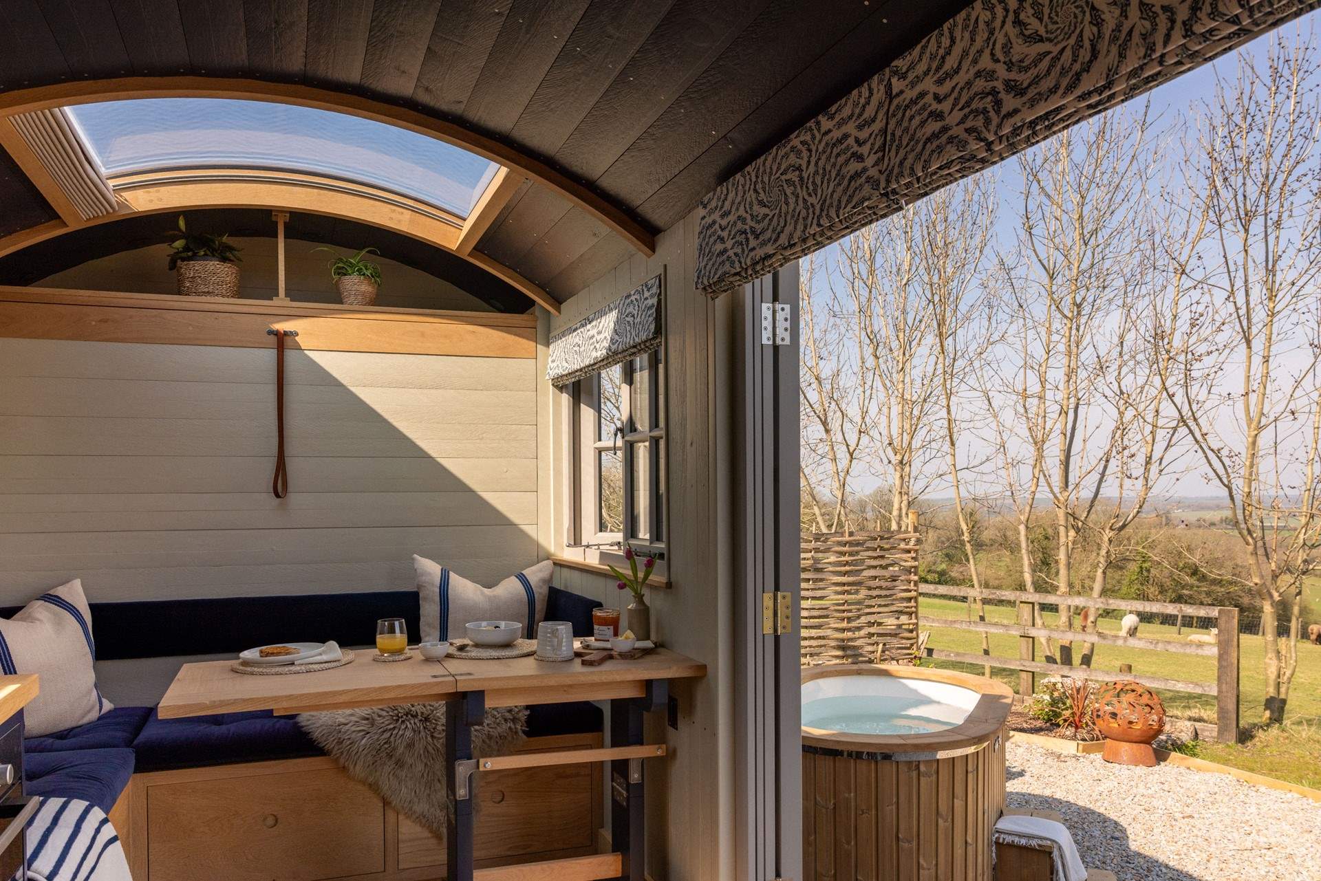 The fold-down table and seating area provide the perfect spot for slow breakfasts or relaxed evening meals.