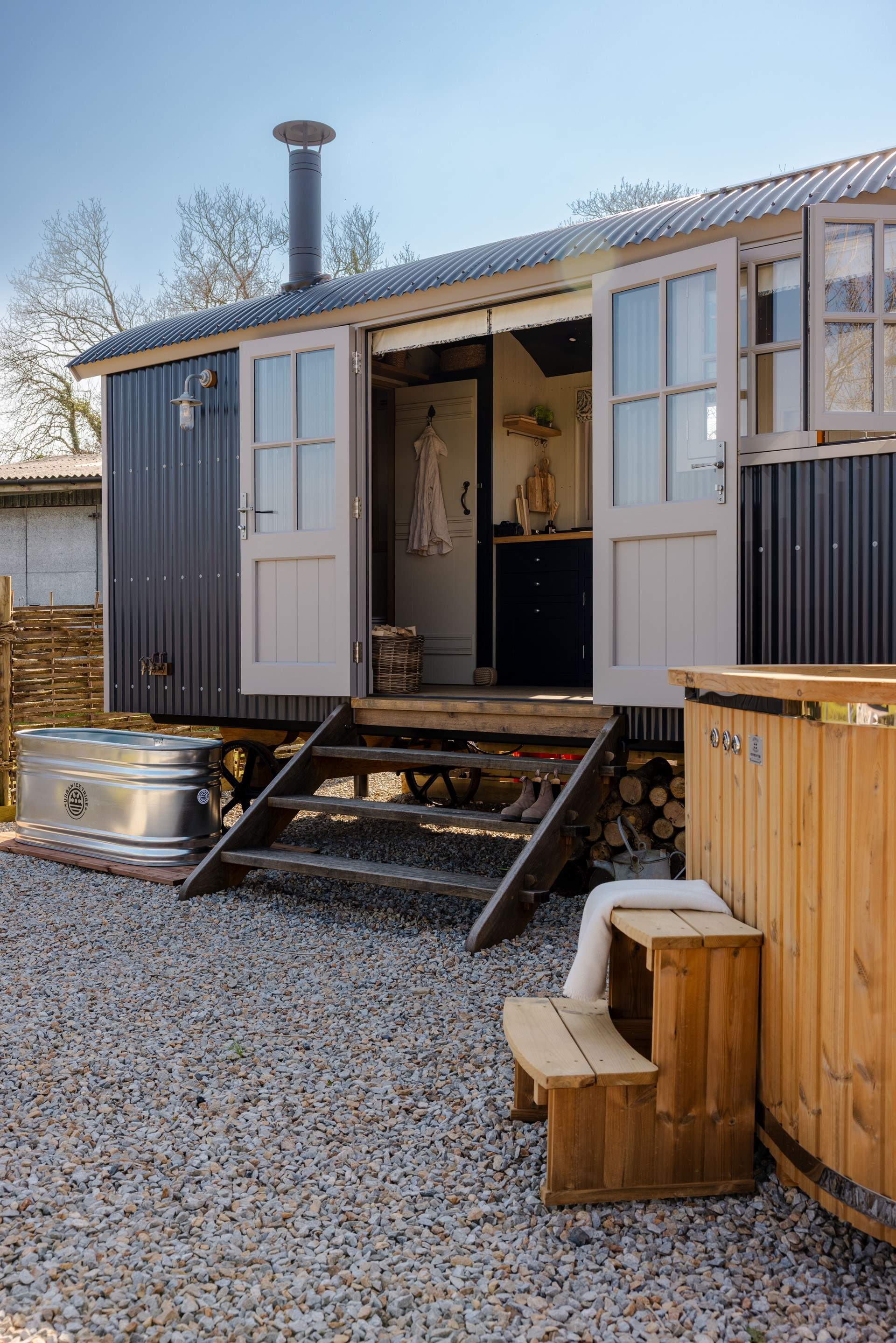 Move between the soothing hot tub and the cold plunge bath for a true wellness experience.