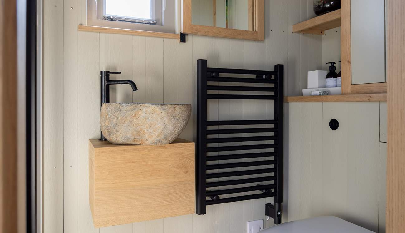 You'll find the sleek shower-room just beyond the kitchen.