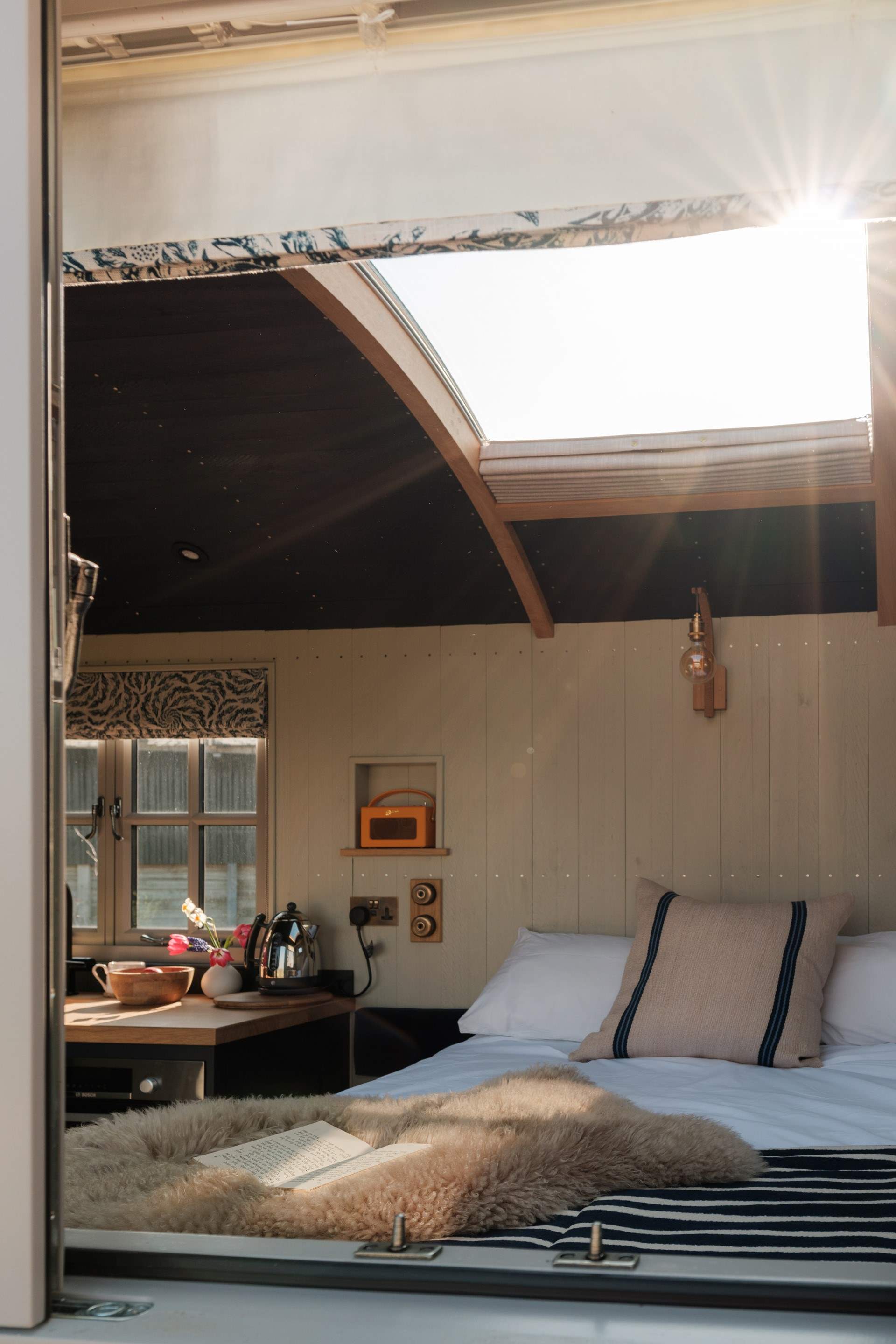 Look up at the night sky through the stargazing window.