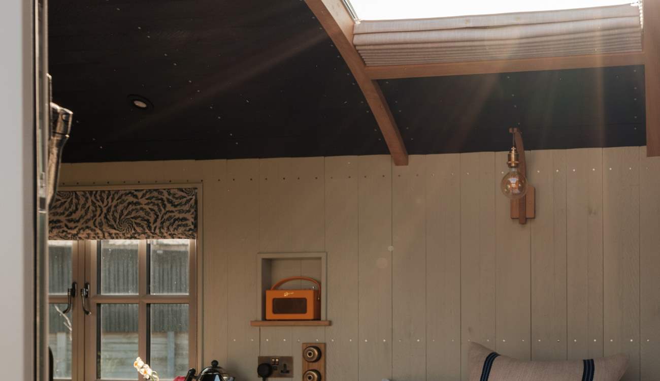 Look up at the night sky through the stargazing window.