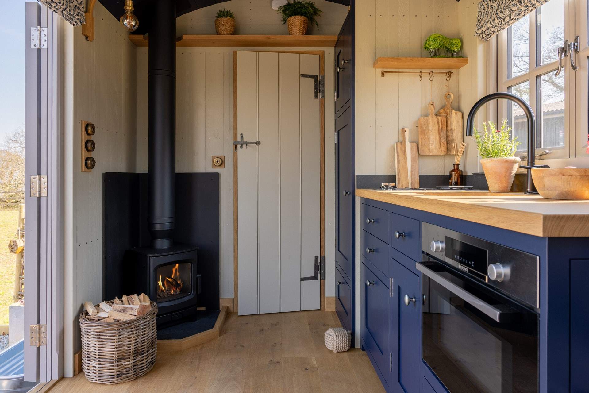 Gather beside the crackling wood burner for cosy evenings in. 