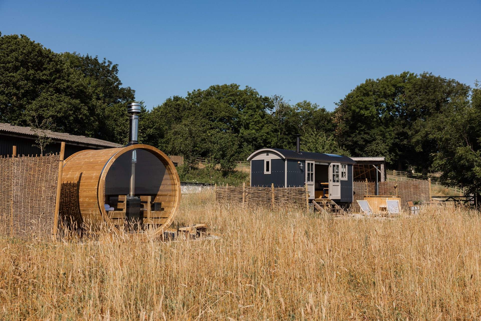 The wood-fired barrel sauna, hot tub and cold plunge elevate this retreat into a true wellness getaway. 