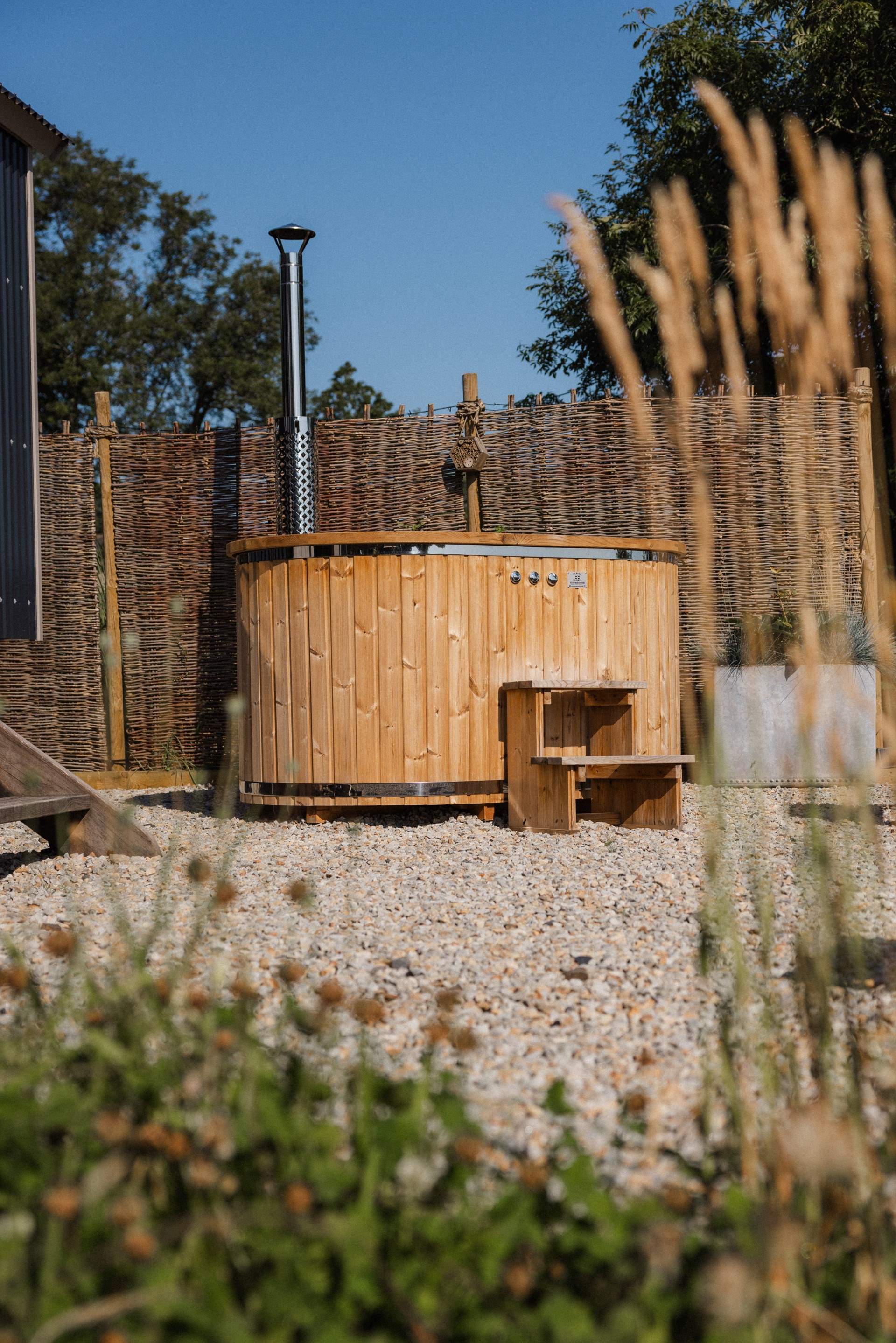 Why not sink into the wood-fired hot tub with a glass of bubbles in hand?  