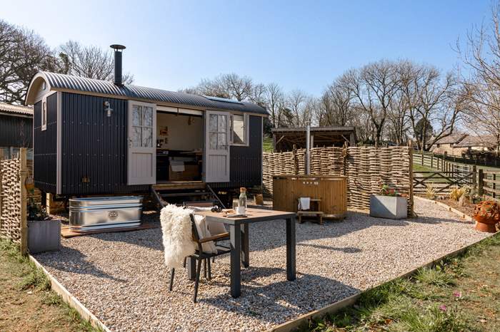 Azure Sky is a Shepherds Hut with wood-fired hot tub and outdoor bath near Tintagel, Cornwall