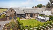 Escape to the spellbinding beauty of the Brecon Beacons to The Retreat, an exquisite complex of three superbly renovated barn conversions, with large swim spa, near Crickhowell and Abergavenny. 