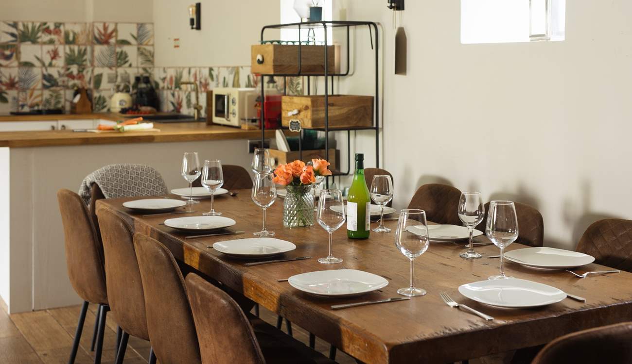 Gather round the large dining-table in The Coach House. 