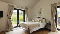 Take in the mountain scenery from the king bedroom in The Coach House. 