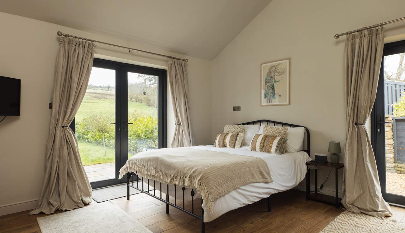Take in the mountain scenery from the king bedroom in The Coach House. 