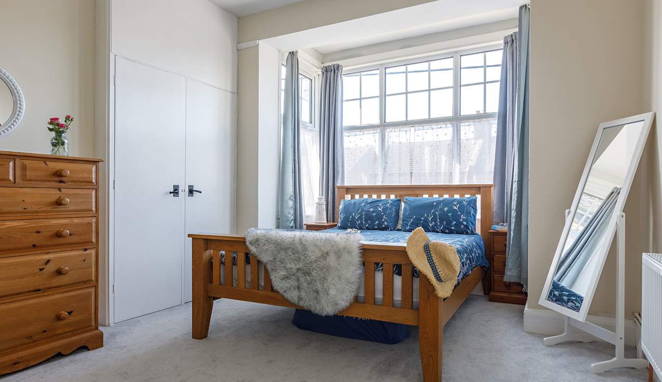 The main bed sits nicely in the bay window where the light floods in, you may hear the waves with the changing tides.