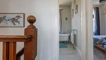 Climb the stairs to the three bedrooms and where a luxury bathroom awaits.
