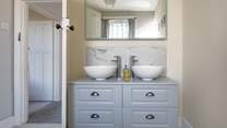 Room for two with twin basins in the family bathroom.