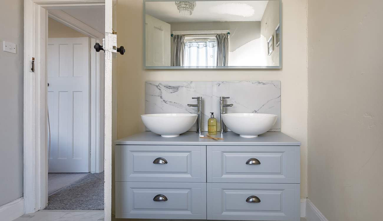 Room for two with twin basins in the family bathroom.