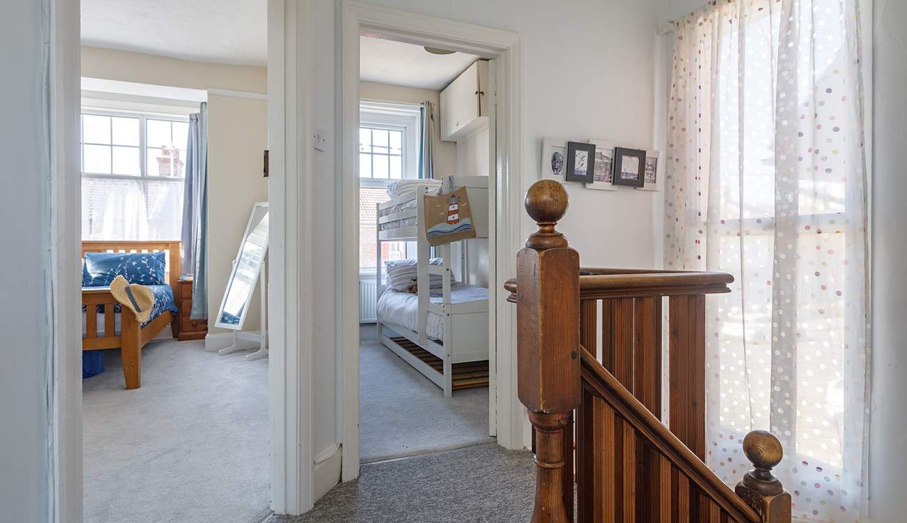 A large double bedroom and full-size bunks enjoy a westerly aspect, even a sea glimpse!