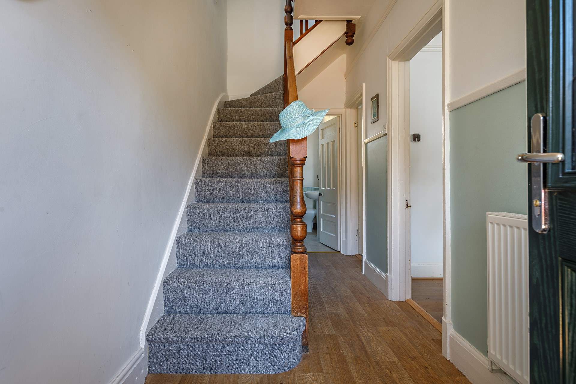 Climb the stairs to the bedrooms and family bathroom at this seaside escape.