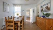 The dining-area leads seamlessly into the kitchen where the chef can join in with holiday banter.
