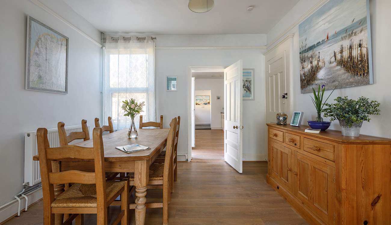 The dining-area leads seamlessly into the kitchen where the chef can join in with holiday banter.