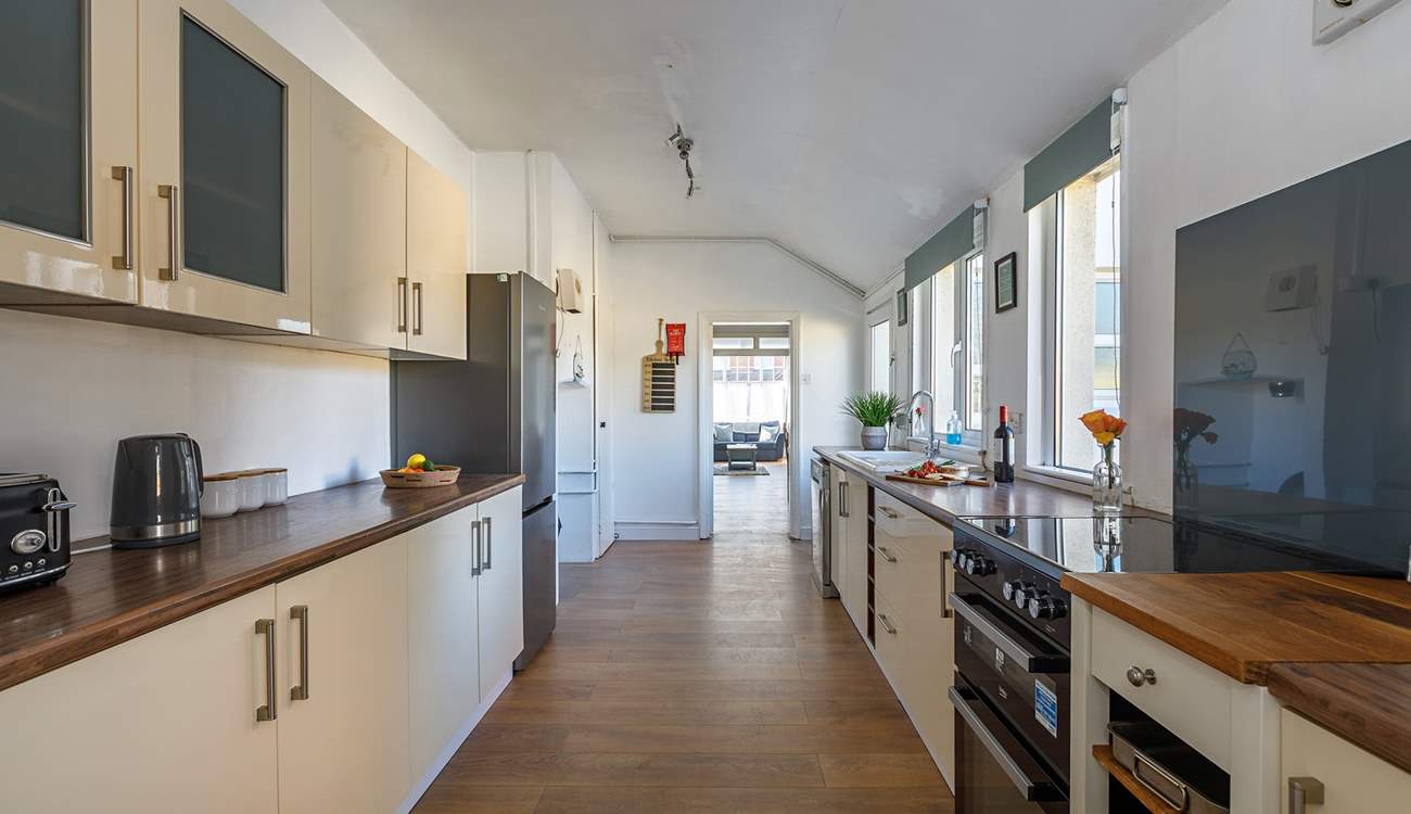The spacious kitchen looks through to the open plan living/dining area; perfect for chatter with loved ones.