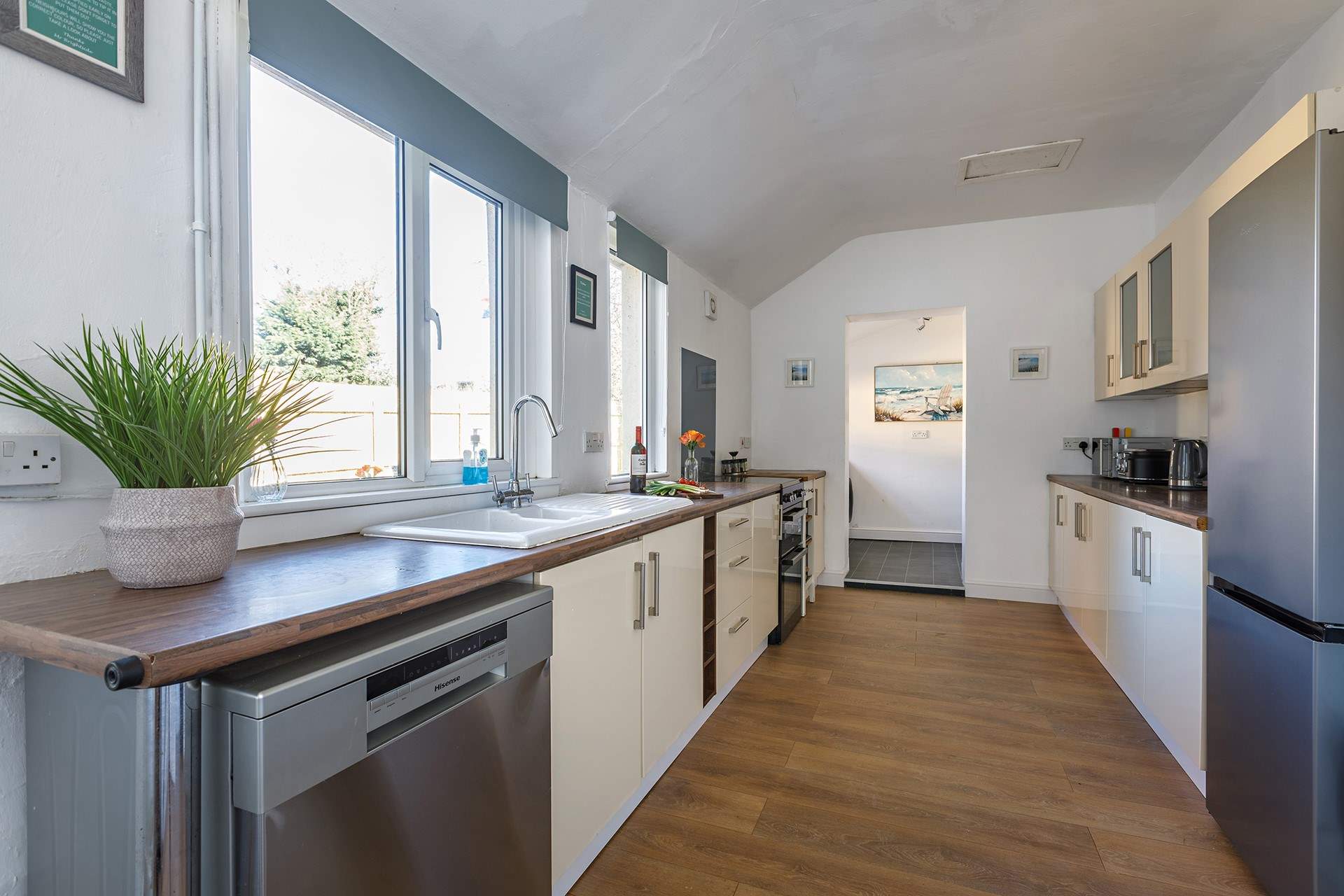 The dishwasher will handle the washing up with ease, plus there's a handy utility tucked away at the end of the kitchen.