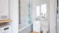 The stylish family bathroom features a bath with fitted shower catering for everyone's needs.