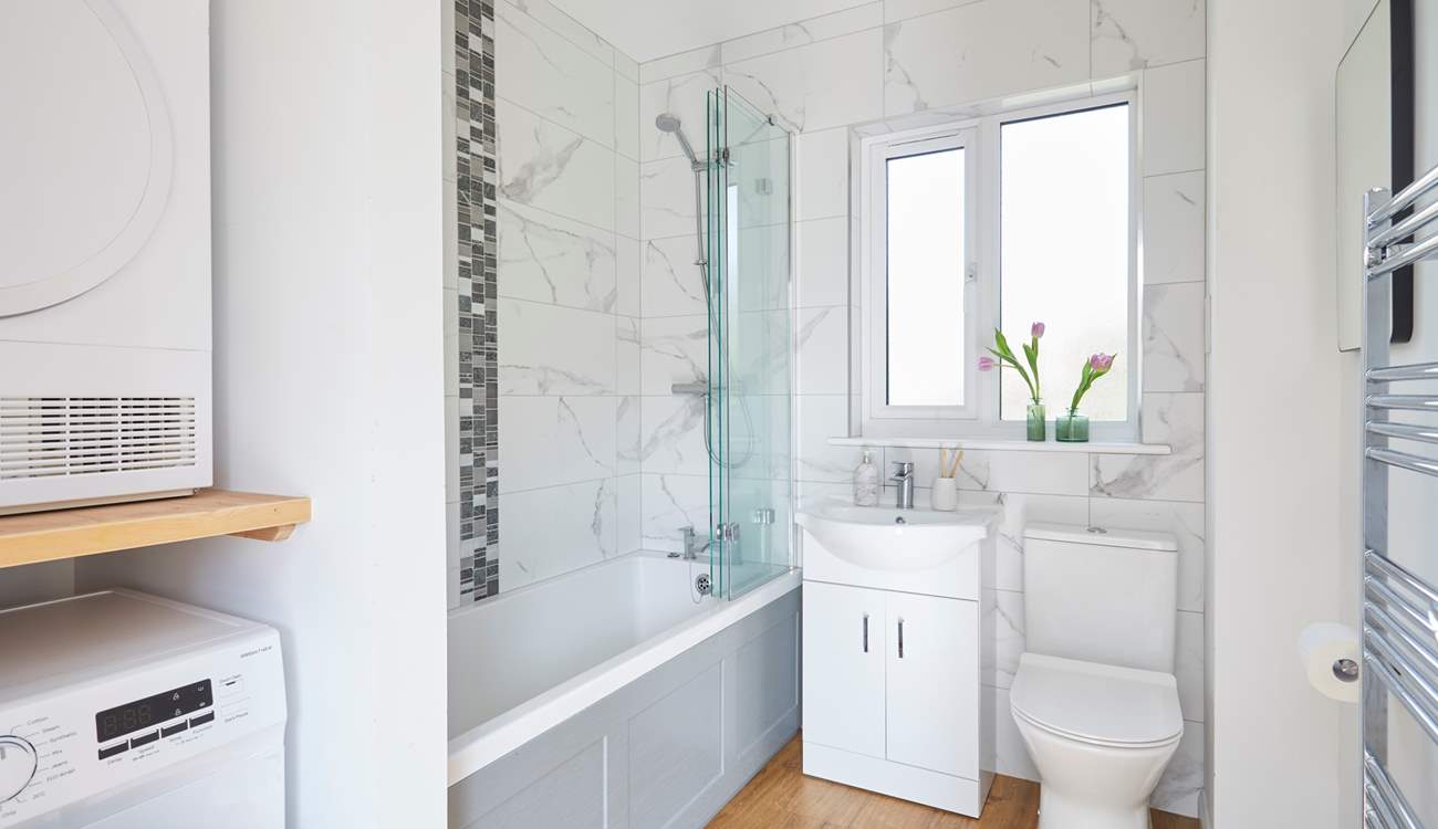 The stylish family bathroom features a bath with fitted shower catering for everyone's needs.