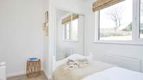 Bathed in natural light and with a tranquil outlook, this is a calming space to retreat to.