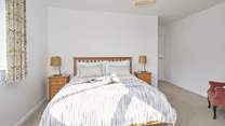 Bedroom 3 with king-size bed is situated to the front of the property.