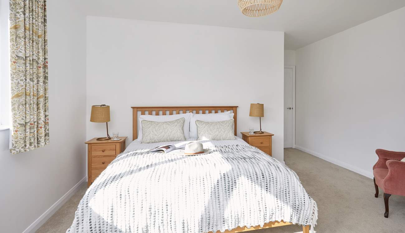 Bedroom 3 with king-size bed is situated to the front of the property.