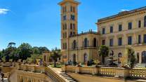 Visit Osborne House, once the palatial home of Queen Victoria. You will find stunning gardens, a private beach and the house here. 