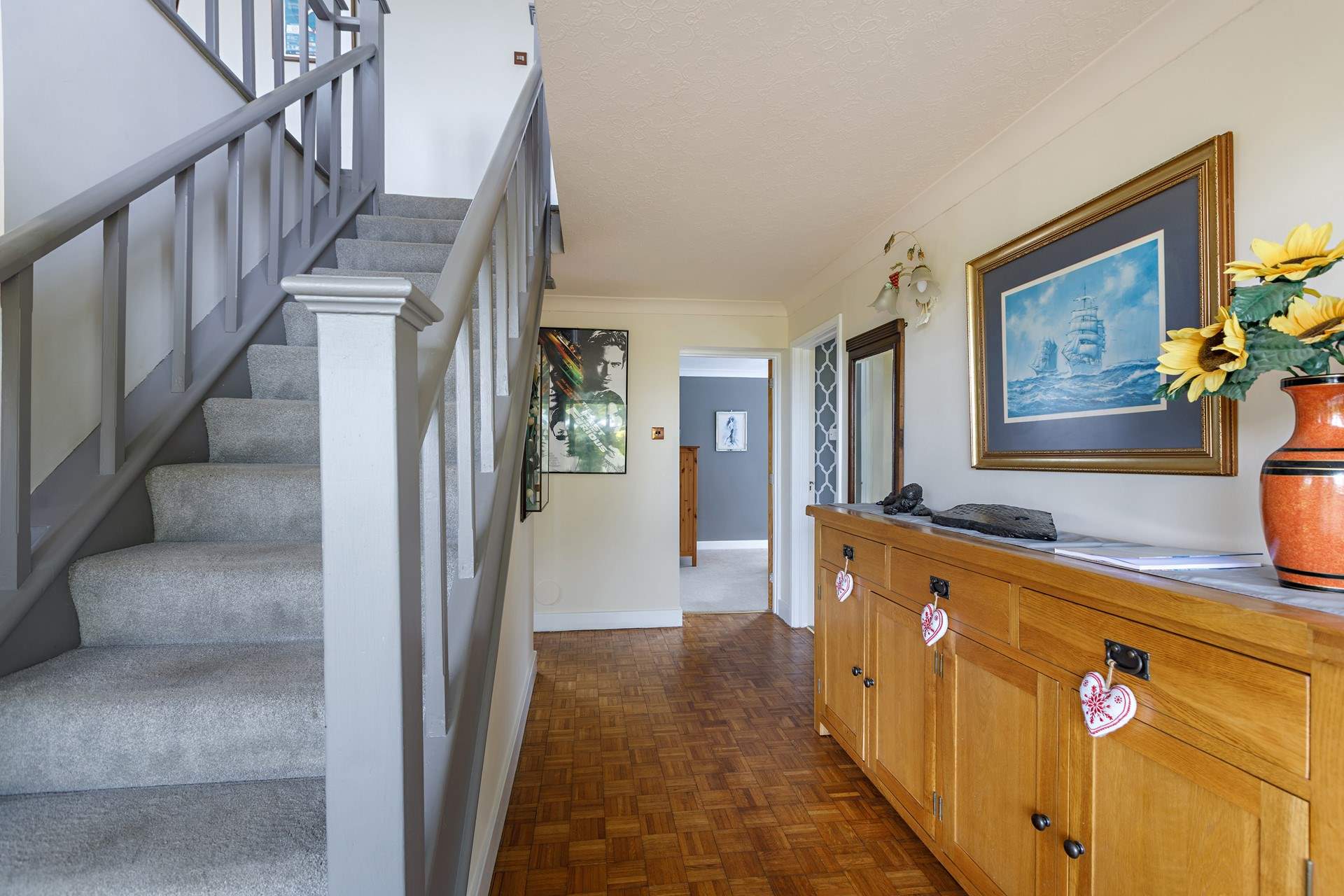 A welcoming hallway. The stairs lead to the kitchen and living areas. 