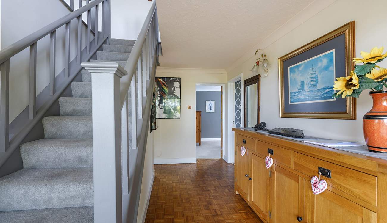 A welcoming hallway. The stairs lead to the kitchen and living areas. 