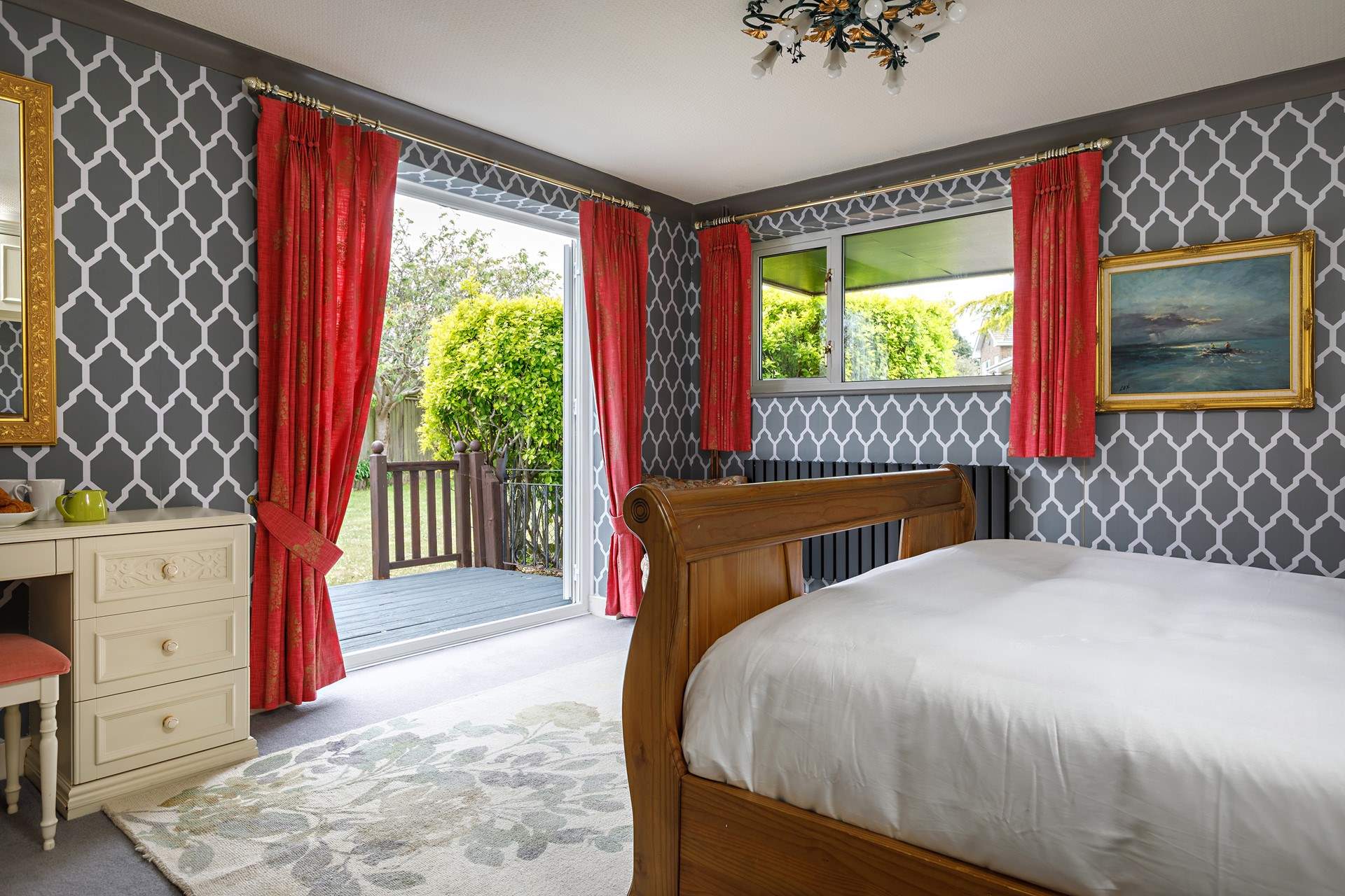 Double doors open to the decking and garden.